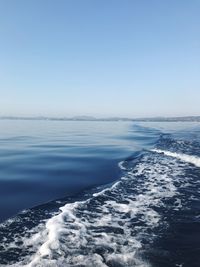 Scenic view of sea against clear blue sky