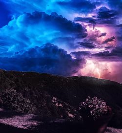 Scenic view of mountains against sky at dusk