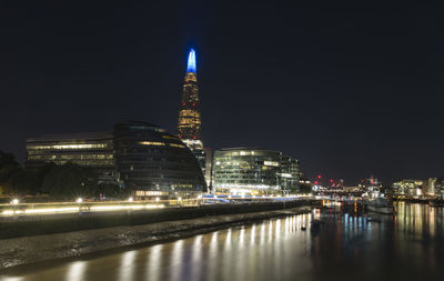 Illuminated buildings in city at night