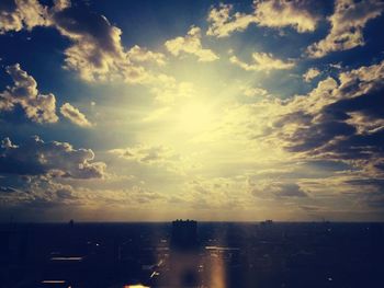 Clouds over city at sunset