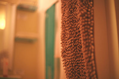 Close-up of bath mat hanging at home