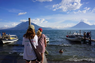 Panoramic view of people standing on beach