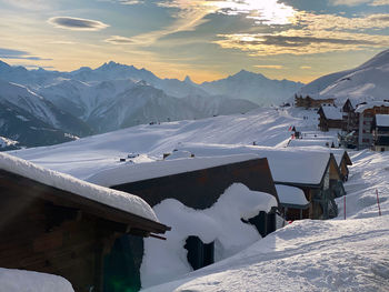 Scenic view of snow covered mountains against sky