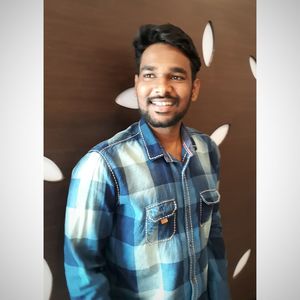 Portrait of smiling man standing at home