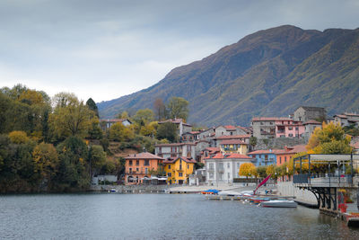 Scenic view of river and mountains against sky