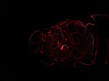 Illuminated light painting in darkroom