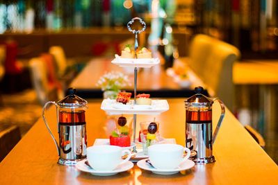 Desserts on cakestand on table