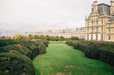 View of lawn with buildings in background