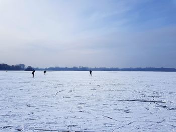 Scenic view of frozen lake against sky