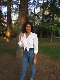 Portrait of a smiling young man in forest