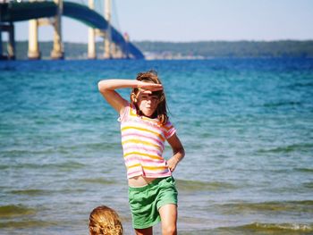 Full length of smiling boy on beach