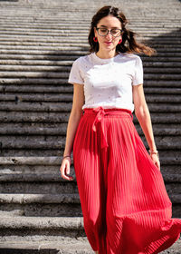 Smiling woman walking on staircase