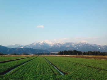 Scenic view of mountains against cloudy sky