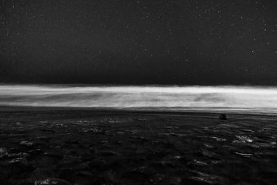 Scenic view of sea against sky at night