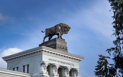 Low angle view of statue against sky