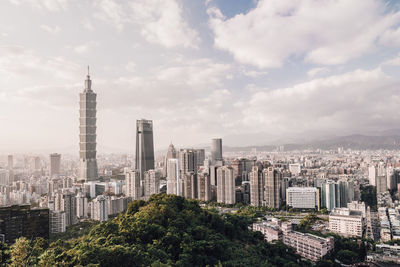 Modern buildings in city against sky