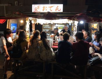 Group of people in restaurant at night