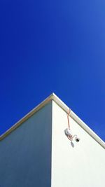 Low angle view of building against clear blue sky