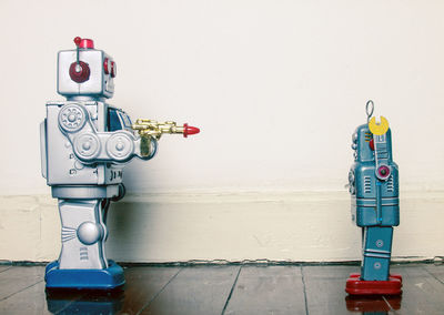 Close-up of fire hydrant against wall