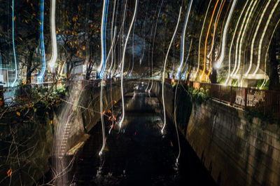 Light trails over canal at night