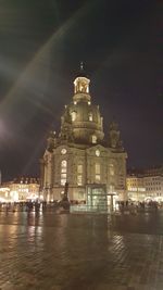 Illuminated buildings in city at night