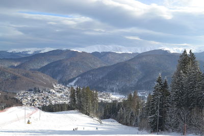 Snow covered mountains against sky