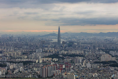 High angle view of city buildings against sky during sunset