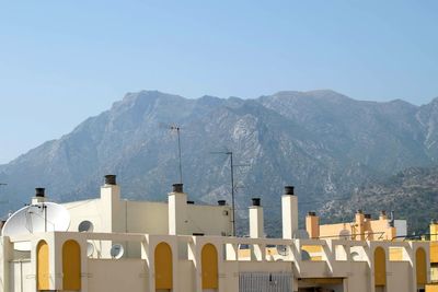 Buildings with mountains in background