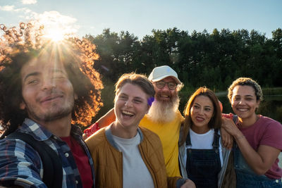 Wanderlust lifestyle, selfie, multiracial group of trendy people having fun together on vacation