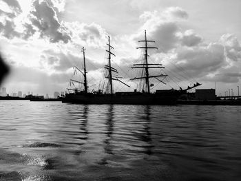 Sailboats in sea against sky