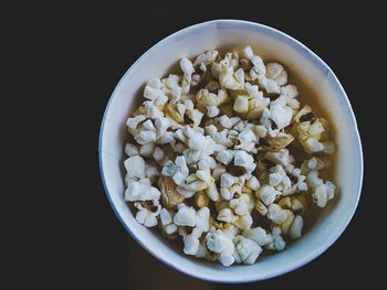 High angle view of salad in bowl against black background