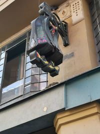 Low angle view of clothes drying against building