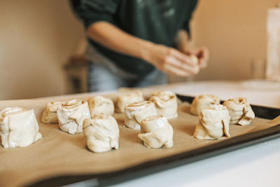 Midsection of man preparing food on table