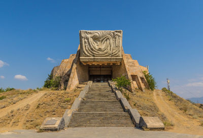 Low angle view of temple against blue sky