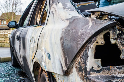 Abandoned car on road