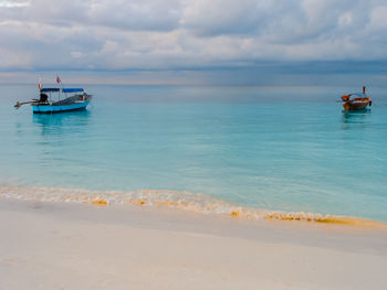 Boat in sea against sky