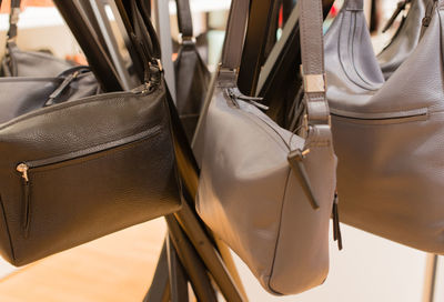 Close-up of bags hanging in market for sale