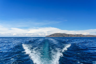 Scenic view of sea against blue sky