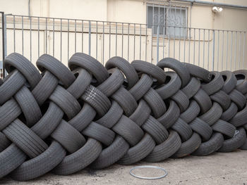 Tires on road against house