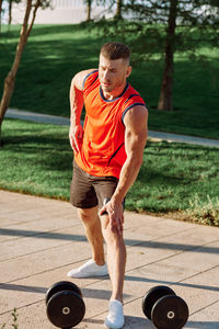 Side view of man exercising in park