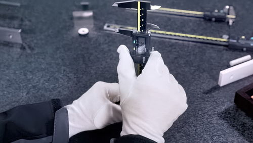 Close-up of hand holding paper hanging