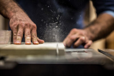 Close-up of man working on table