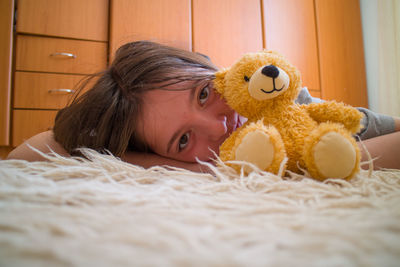 Young woman with stuffed toy