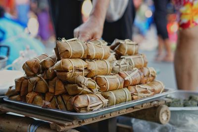 High angle view of bundled boiled ricef  for sale at market