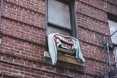 Low angle view of clothes drying on building