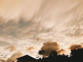 Low angle view of silhouette trees against sky during sunset