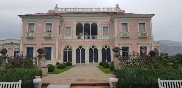 Facade of historic building against sky