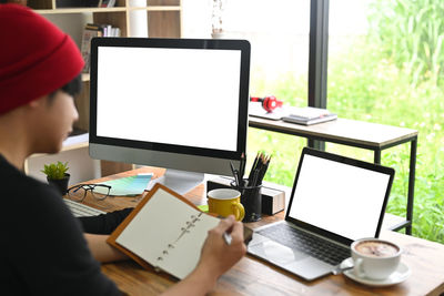 Man using laptop on table