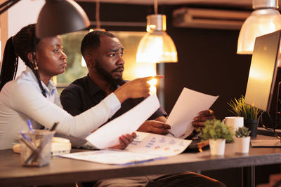 Businessman with colleague working at office