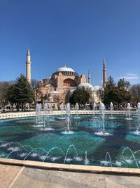 View of swimming pool in building against sky